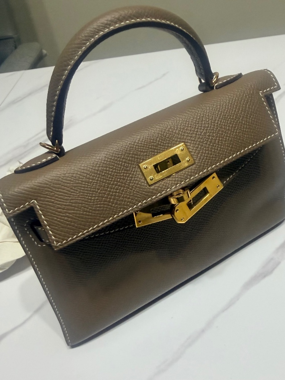 Mini top handle bag.. Kelly